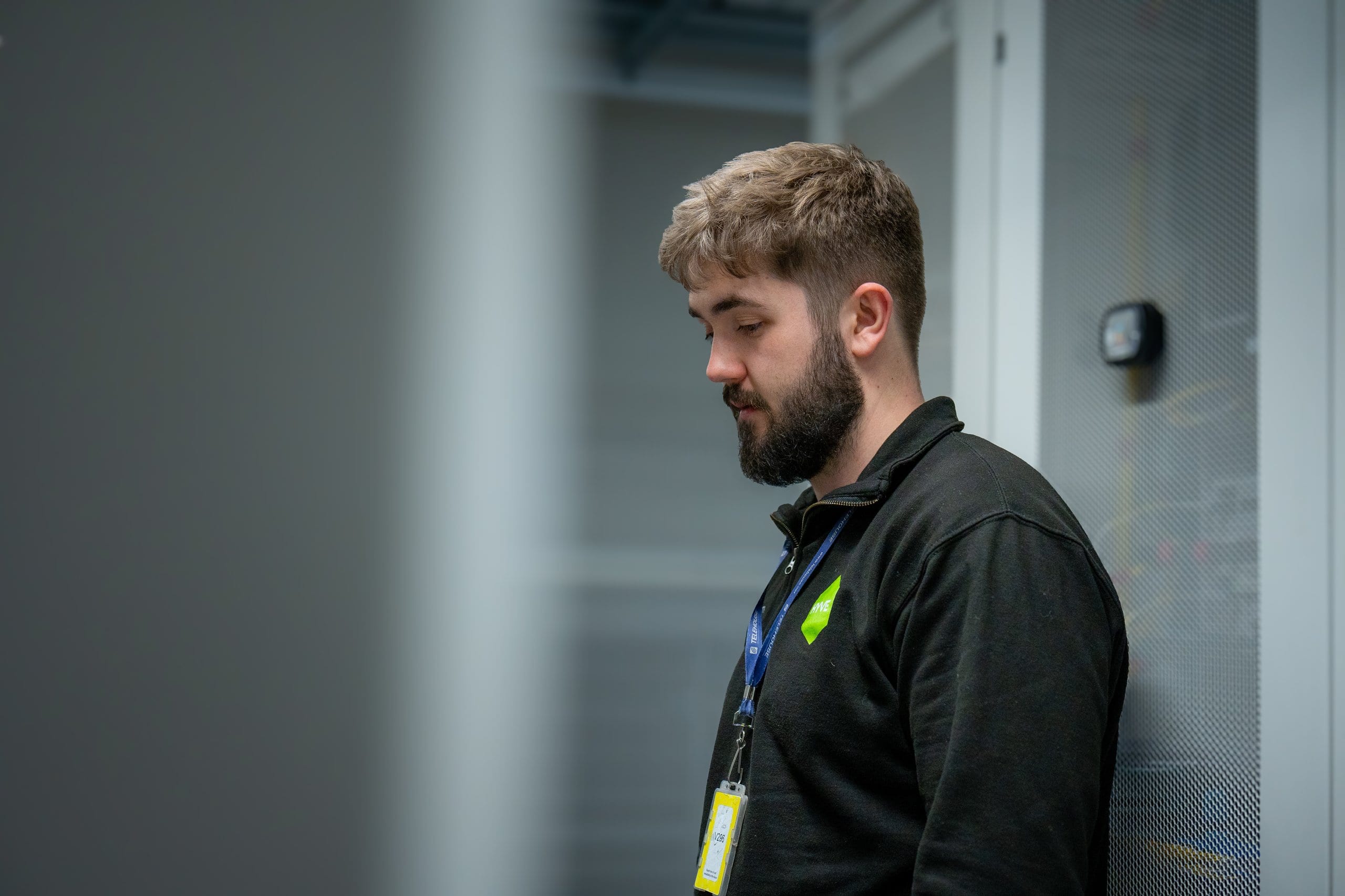 Hyve engineer beside a server cabinet