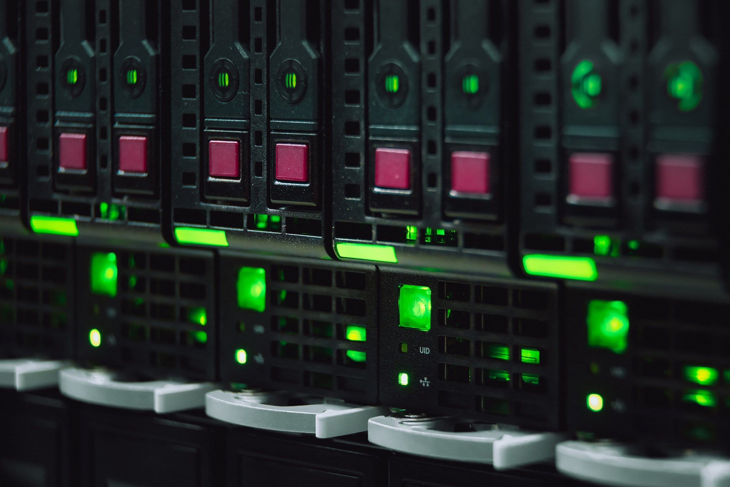 Close-up of a server rack with green status lights