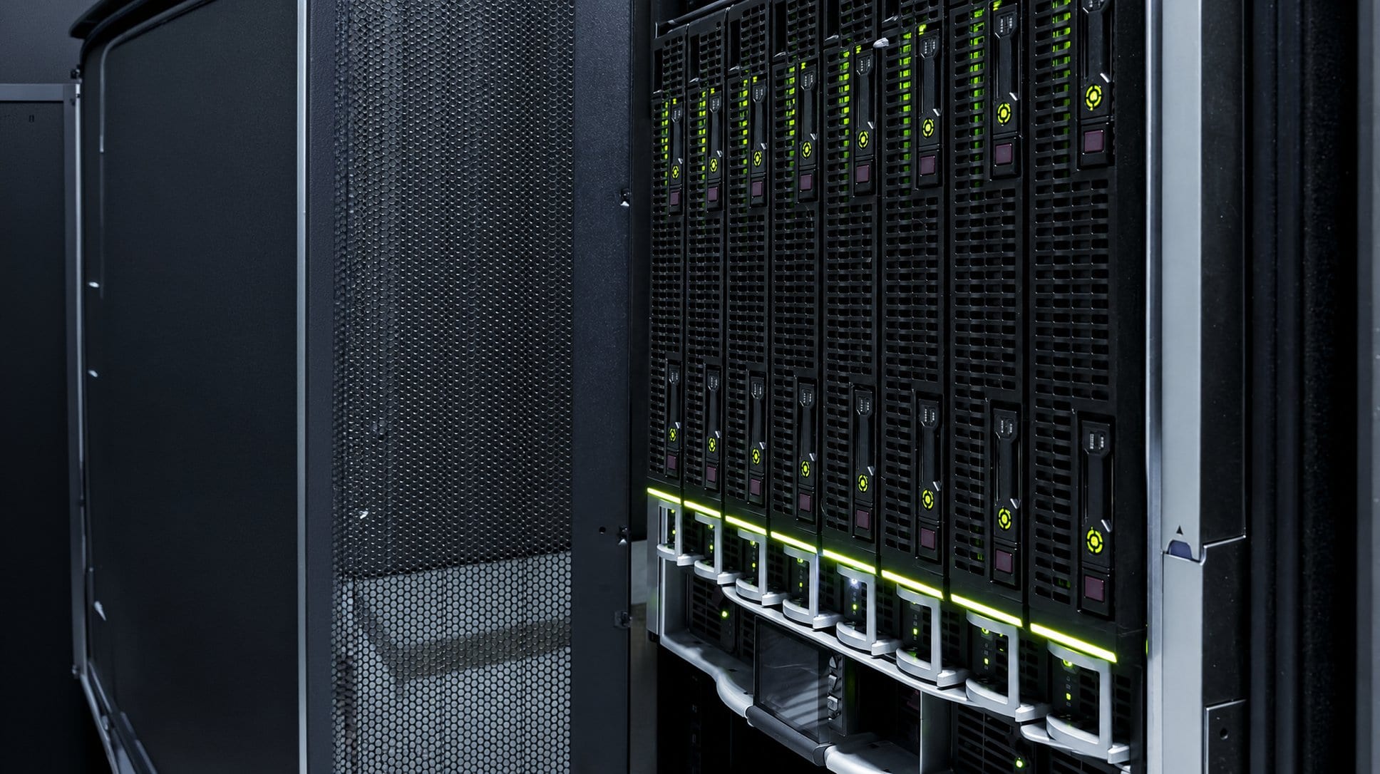 Server blades with green status lights in a rack