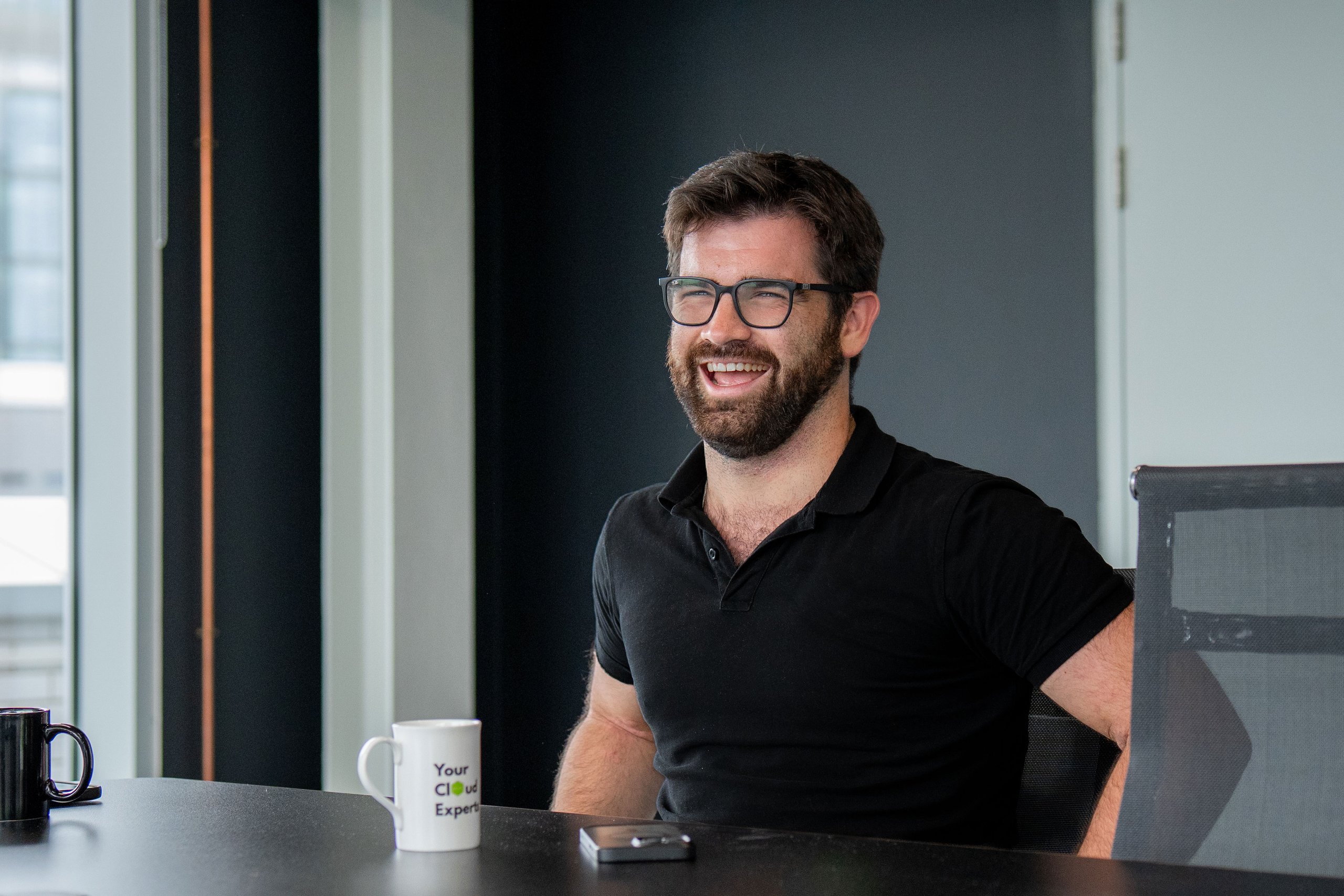 Cloud specialist smiling during a consultation