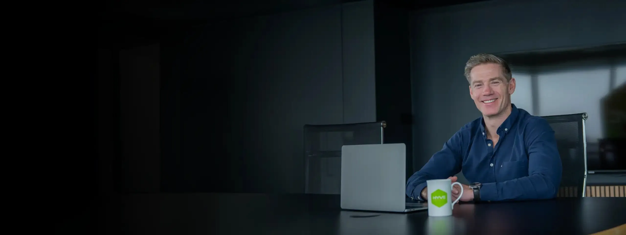 Professional in an office using a laptop