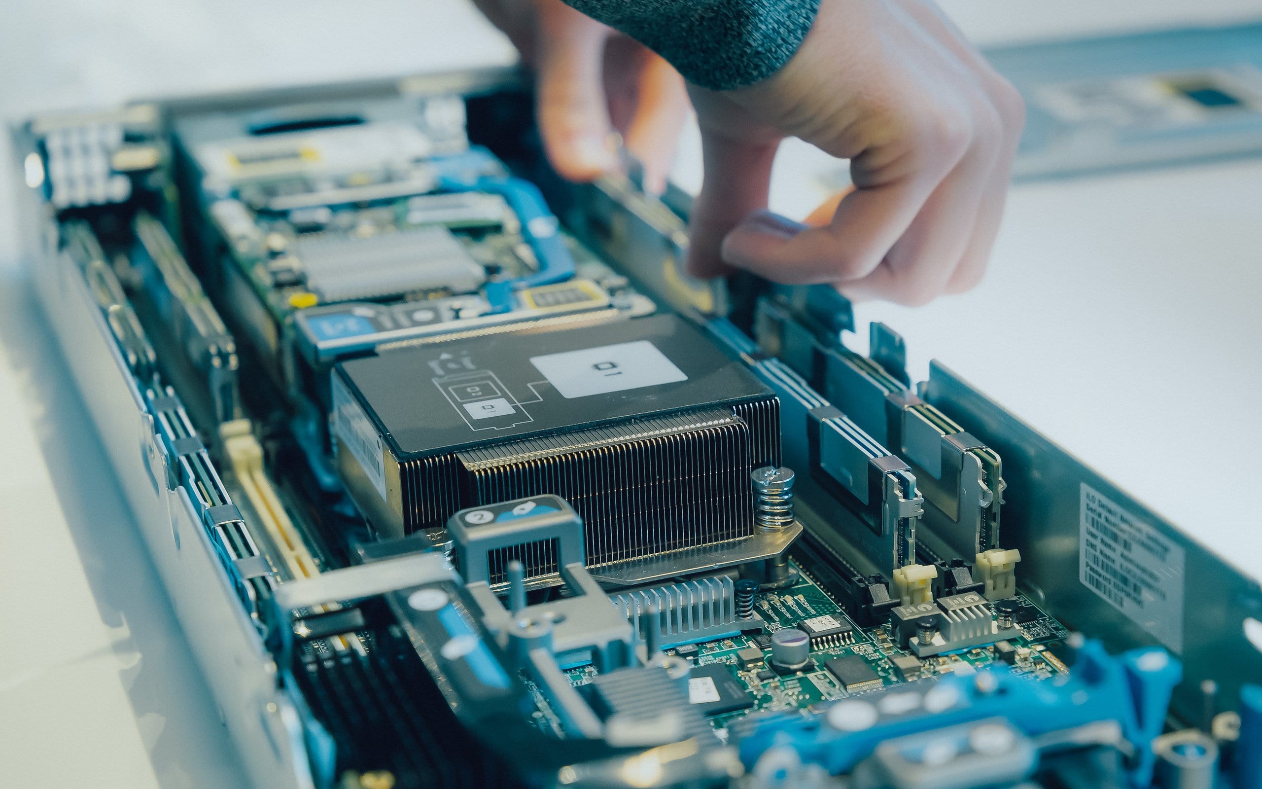 Technician installing a processor in a server