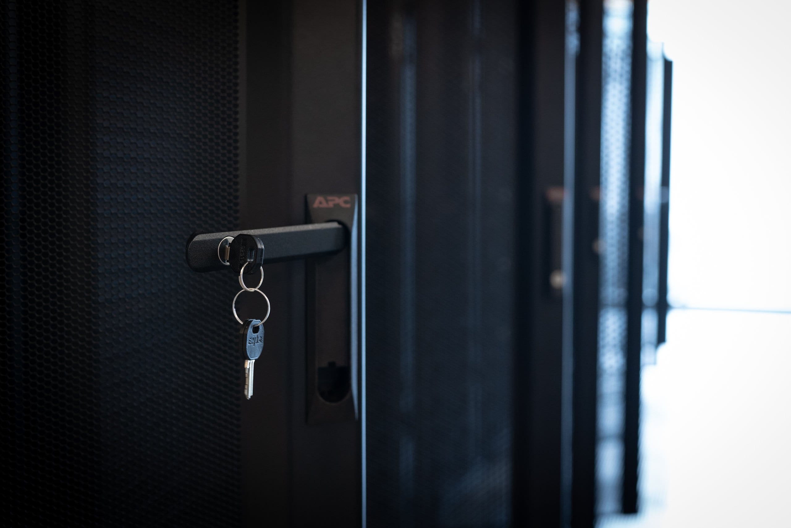 Keys in the lock of a server cabinet