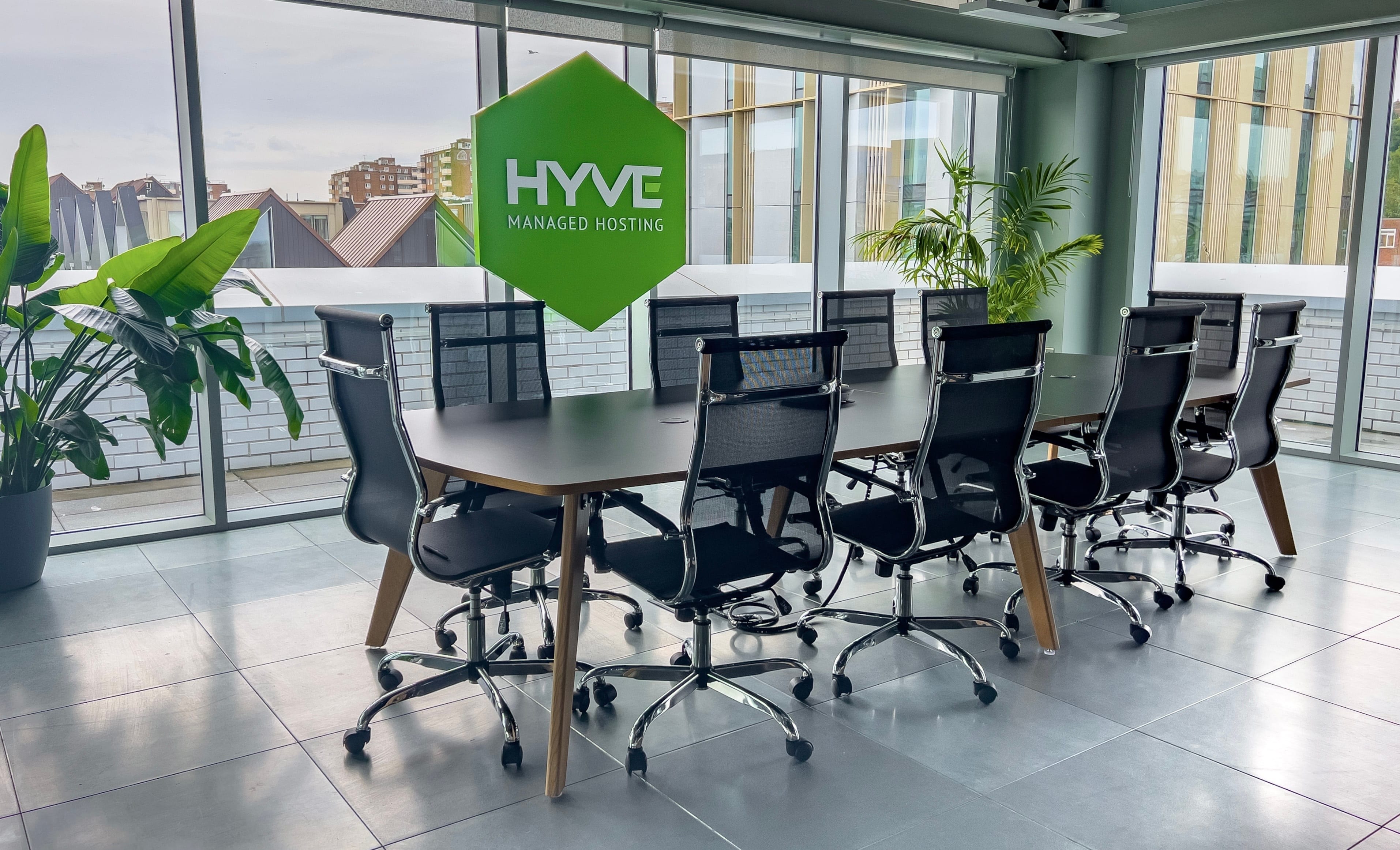 Hyve boardroom with the logo in the window