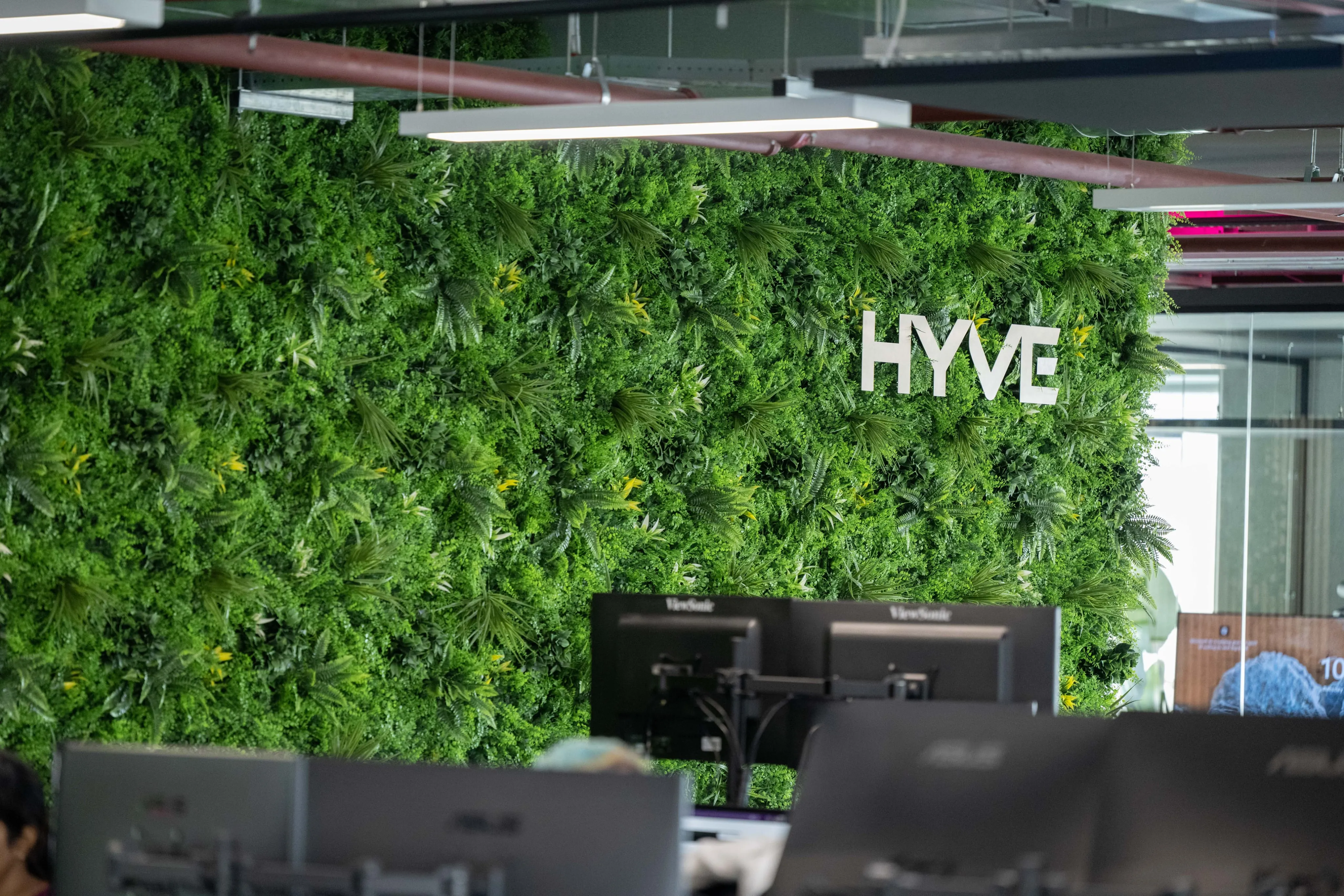 Hyve logo on a green living wall
