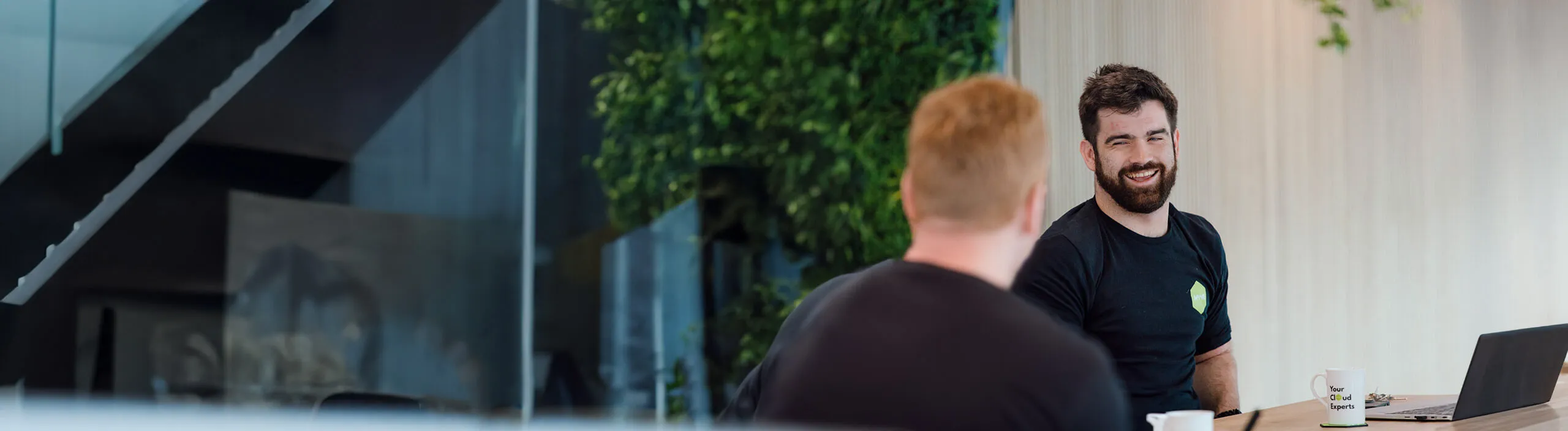 Two colleagues talking in the Hyve office